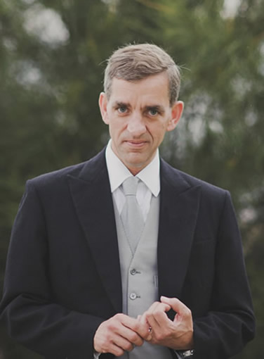 James Dennison, the Sunny Coast Celebrant, in full formal attire